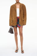 Tan suede jacket with notch lapels and flap pockets