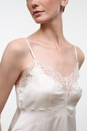Ivory silk camisole top with lace trim at neckline and thin spaghetti straps