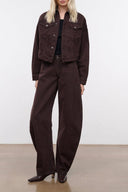 Dark brown denim jacket with button front and two chest flap pockets