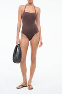 One-piece swimsuit in dark brown with red halter straps