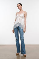 Ivory silk camisole top with thin straps and scalloped blue lace trim