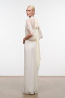 Ivory mock-neck maxi dress with cape-like sheer sleeves and long flowing skirt