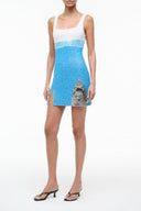Sleeveless scoop-neck mini dress with blue speckled graphic print, fitted waist