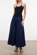 Navy gathered midi skirt with elastic waistband and full A-line silhouette