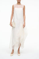 Ivory sleeveless midi dress with round neck and layered draped panels
