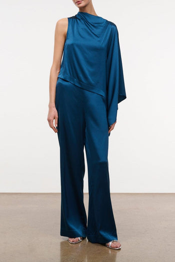 Silk wide-leg pants in deep blue, draped straight legs and relaxed fit