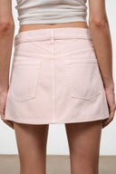 Rose mini skirt close-up of front flap pockets and button placket