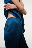 Blue silk wide-leg pant with elastic waist and side drape detail