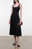 Black sleeveless jersey midi dress with scoop neckline and pleated skirt