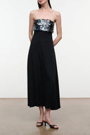 Black strapless evening dress with silver sequin bodice and long A-line skirt
