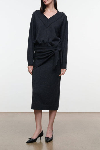 Dark knit sweater dress with V-neck, long sleeves, and waist-tie drape