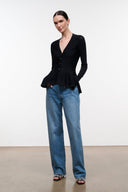 Black peplum top with V-neck and button placket, long sleeves