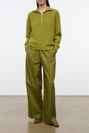 Olive green wide-leg pants with elastic waist and drawstring, ankle length