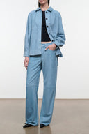 Light sky-blue button-up shirt with pointed collar and front pockets