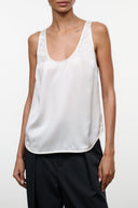 Ivory silk tank top with scoop neckline, sleeveless and relaxed fit
