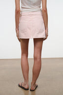 Front view of rose mini skirt with two flap pockets and stitched seams