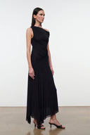 Black one-shoulder ruched maxi dress with draped diagonal detail and asymmetric hem