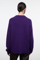 Back view of purple cashmere cardigan with button placket and ribbed hem