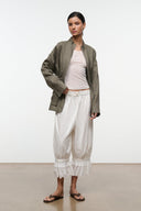 Olive linen zip jacket with stand collar, patch pockets, and tied waist