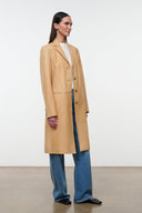 Tan leather long coat with open collar and button-front, side angle view.