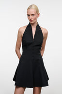 Black halter mini dress with deep V neckline, buttoned bodice and flared skirt