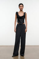 Black silk top with draped neckline and fitted sleeveless bodice