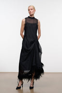 Black sleeveless high-neck dress with draped knot waist and feather-fringe hem