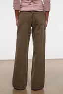 Relaxed olive jeans full view with wide straight legs and relaxed fit