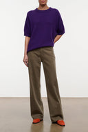 Taupe straight-leg jeans with zipper fly, belt loops, and side pockets
