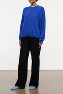 Black wide-leg jeans with elastic waistband, side view