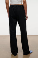Black wide-leg jeans with gathered elastic waist and full-length legs