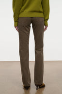 Straight jeans rear view in dark brown, two patch pockets, raw hem