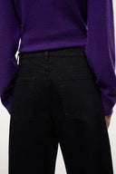 Black relaxed jeans back view with yoke seam and large patch pockets