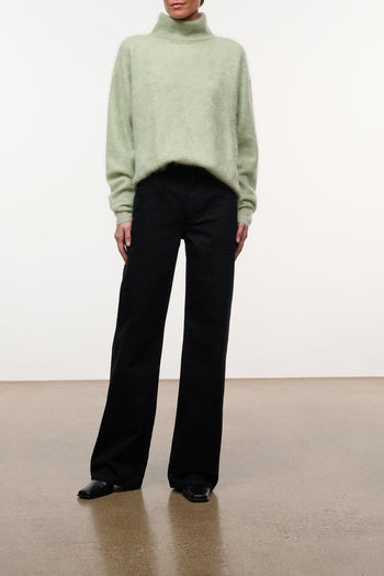 Black wide-leg jeans with button fly, belt loops, and front pockets
