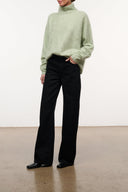 Black wide-leg jeans with relaxed straight leg and front button closure