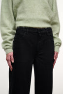 Black denim jeans with belt loops and buttoned waistband detail