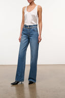 High-rise vintage wash jeans with crystal-belt waistband detail and relaxed wide leg opening