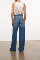 High-rise vintage wash jeans with crystal-belt waistband detail and relaxed wide straight legs