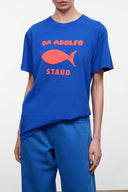 Blue crewneck graphic T-shirt with red shark and DA ADOLFO STAUd text