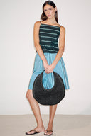 <p>A go-to for warm weather escapes, our softer woven raffia Moon does double duty as both an everyday tote and a chic beach bag.</p>