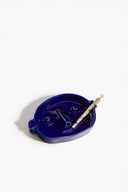 Henry Blue ceramic ashtray with face-like relief and cigar-rest slot, blue tray