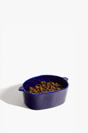 Henry blue ceramic small dog bowl with kibble-filled interior