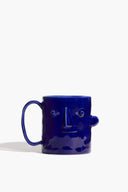 Henry Blue ceramic mug with side handle and embossed face design