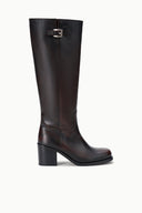 Knee-high dark leather boots with metal buckle strap and block heel