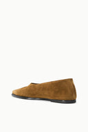 Suede flat slip-on loafers in cigar brown, angled side view