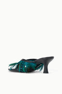 Black heeled mule with teal feather trim across the upper
