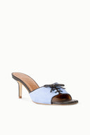 Light blue suede mule sandal with lace-up front, brown footbed, slim high heel