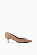 Tan pointed-toe kitten heel pump with bow-tied tassel detail
