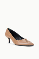 Tan pointed-toe kitten heel pump with bow and cutout ornament at vamp