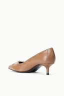 Tan pointed-toe kitten heel pump, side view with bow-tied tassel detail